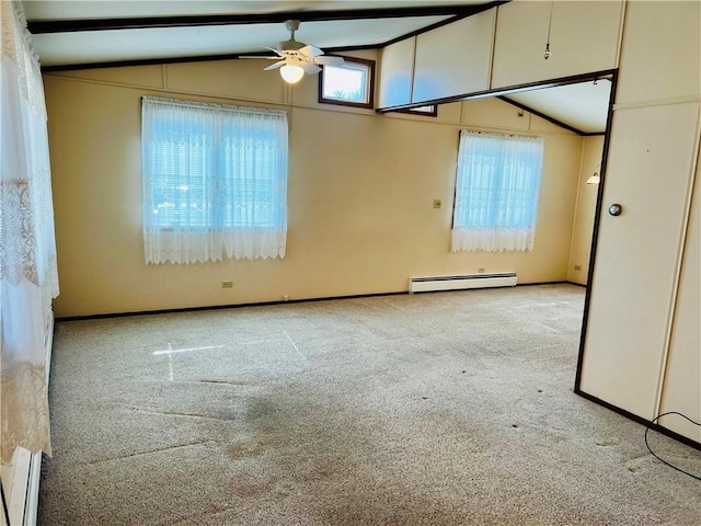 carpeted spare room with a ceiling fan, baseboards, vaulted ceiling with beams, and baseboard heating