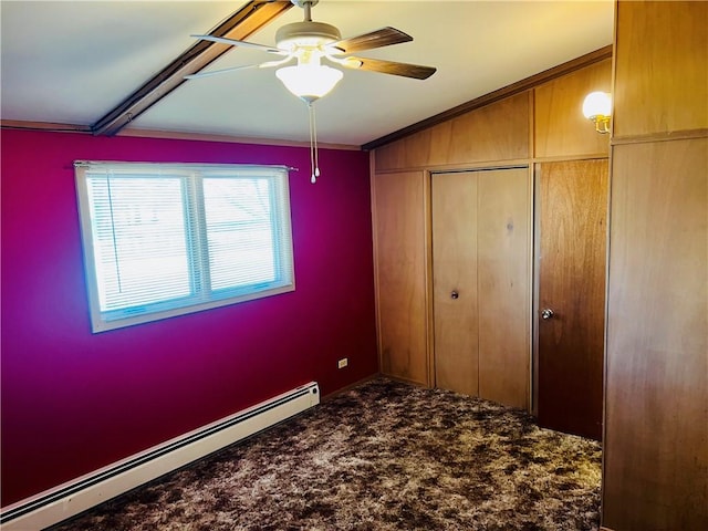 unfurnished bedroom featuring a ceiling fan, a baseboard radiator, a closet, and carpet flooring