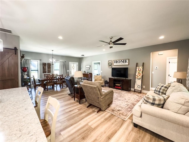 3 Wood Ridge Ln, Marshall, IL 62441 - living area featuring a barn door, recessed lighting, light wood-type flooring, and a ceiling fan