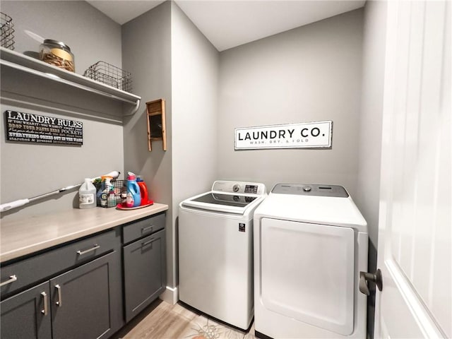 3 Wood Ridge Ln, Marshall, IL 62441 - laundry room featuring independent washer and dryer, cabinet space, and light wood-style flooring