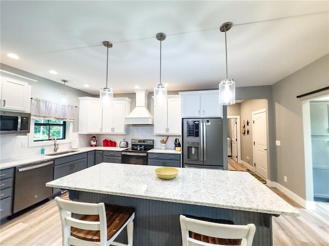 3 Wood Ridge Ln, Marshall, IL 62441 - kitchen with appliances with stainless steel finishes, custom exhaust hood, a kitchen bar, tasteful backsplash, and recessed lighting
