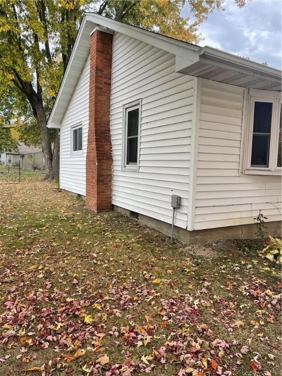 view of property exterior featuring a yard