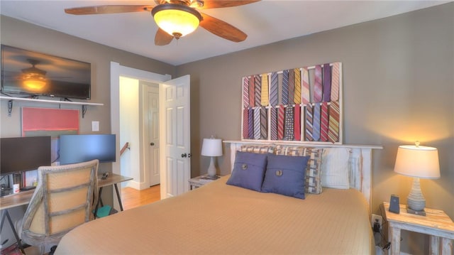 bedroom with ceiling fan and wood finished floors