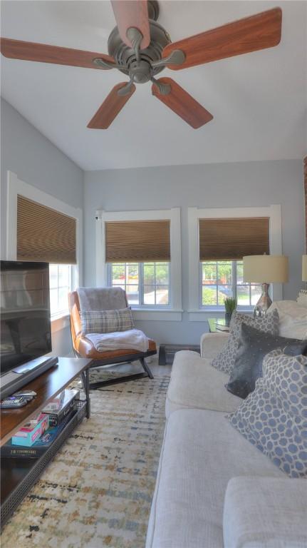 living area featuring ceiling fan and wood finished floors