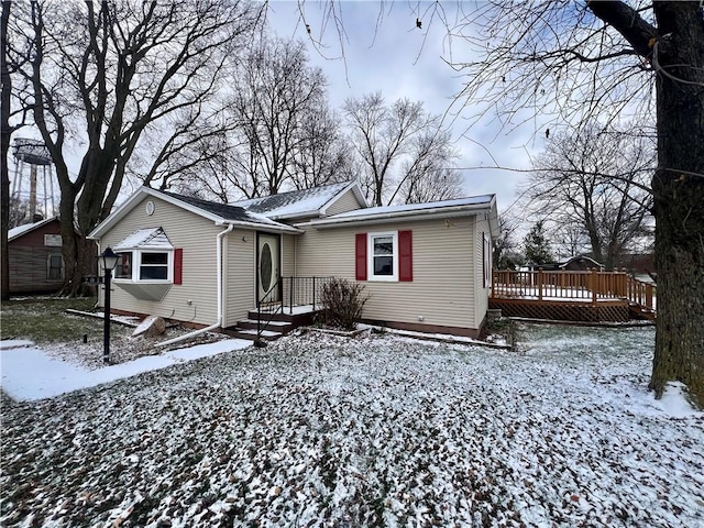 view of front of property with a wooden deck