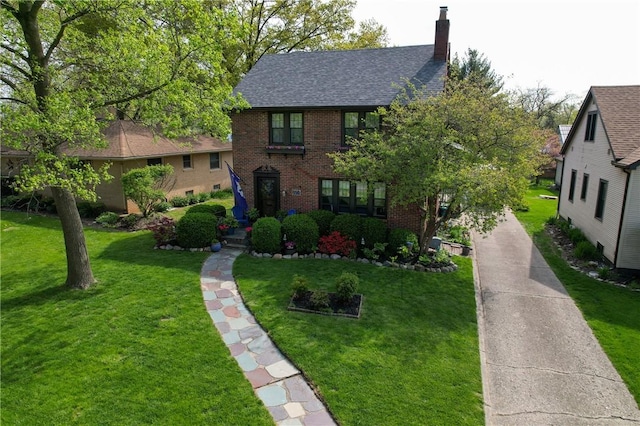 1805 N Gilbert St, Danville, IL 61832 - view of front of home featuring a shingled roof, a chimney, a front lawn, and brick siding