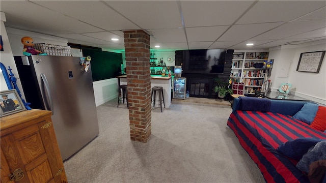 1805 N Gilbert St, Danville, IL 61832 - carpeted living room with a brick fireplace, ornate columns, built in shelves, and a paneled ceiling