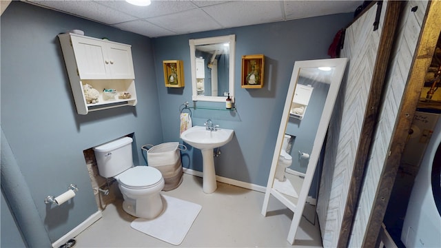 1805 N Gilbert St, Danville, IL 61832 - half bath featuring finished concrete flooring, baseboards, toilet, washer / dryer, and a drop ceiling