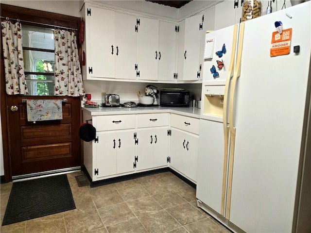 14317 N 920 E Rd, Fairmount, IL 61841 - kitchen featuring white refrigerator with ice dispenser, light countertops, and white cabinetry