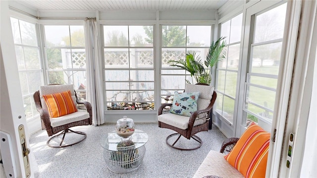 sunroom / solarium with speckled floor