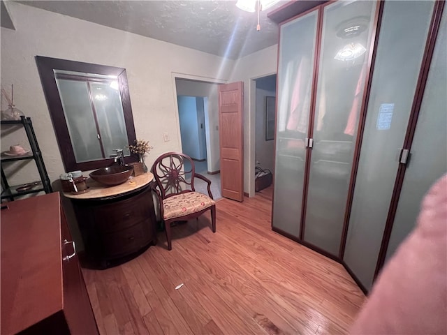 interior space with sink and light hardwood / wood-style flooring