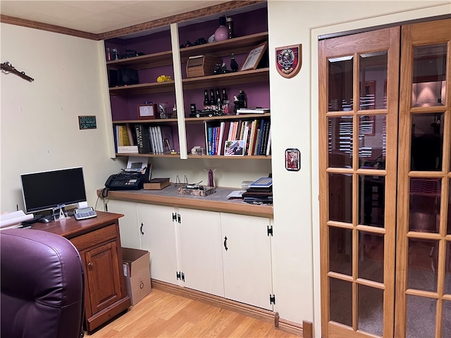 home office featuring crown molding and light wood-type flooring