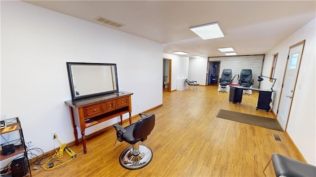 workout room with light wood-type flooring