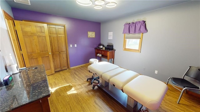 bedroom featuring a closet and light hardwood / wood-style floors