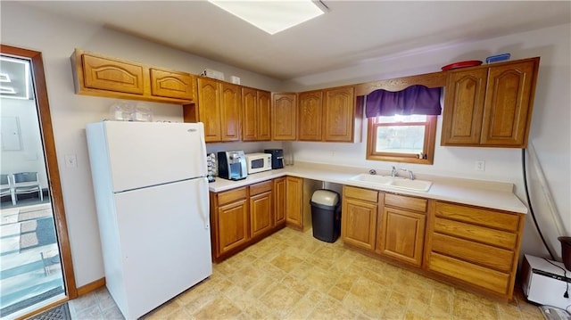 kitchen with white appliances and sink