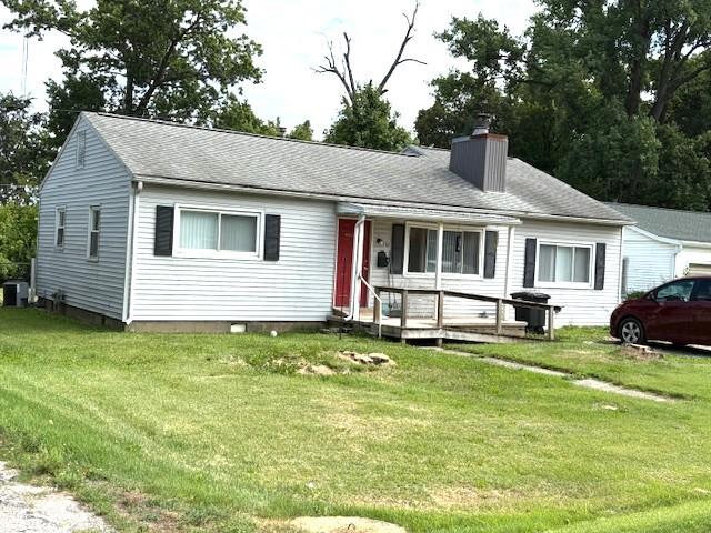 700 E Gordon Ave, Effingham, IL 62401 - single story home featuring a chimney, a front lawn, and a wooden deck