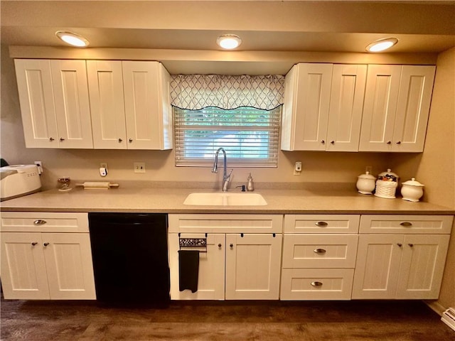 1712 Southdale Dr, Mattoon, IL 61938 - kitchen featuring black dishwasher, white cabinetry, light countertops, and a baseboard radiator