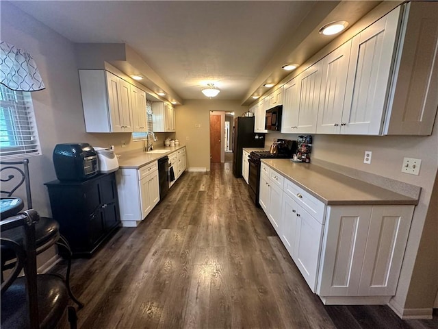 1712 Southdale Dr, Mattoon, IL 61938 - kitchen with black appliances, white cabinets, dark wood-type flooring, and light countertops