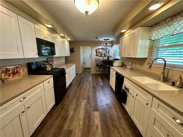 1712 Southdale Dr, Mattoon, IL 61938 - kitchen with black appliances, white cabinets, light countertops, and a textured ceiling