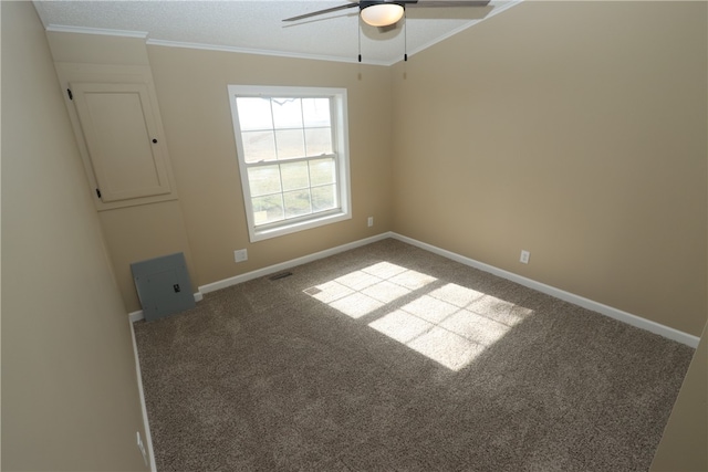 carpeted empty room with electric panel, ceiling fan, and ornamental molding