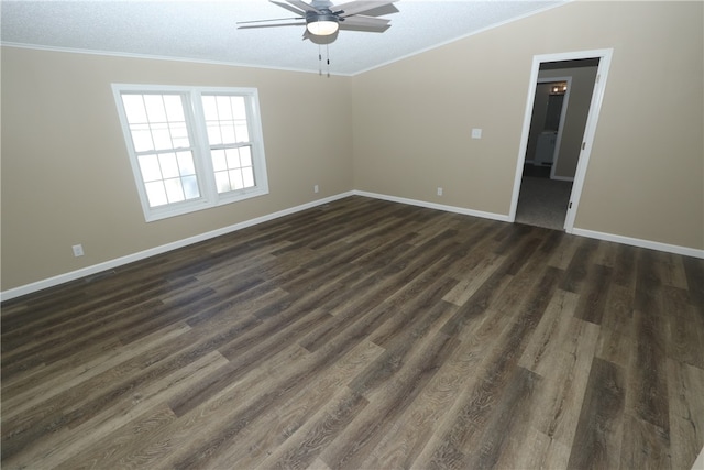 empty room featuring ceiling fan, crown molding, dark wood-type flooring, and a textured ceiling