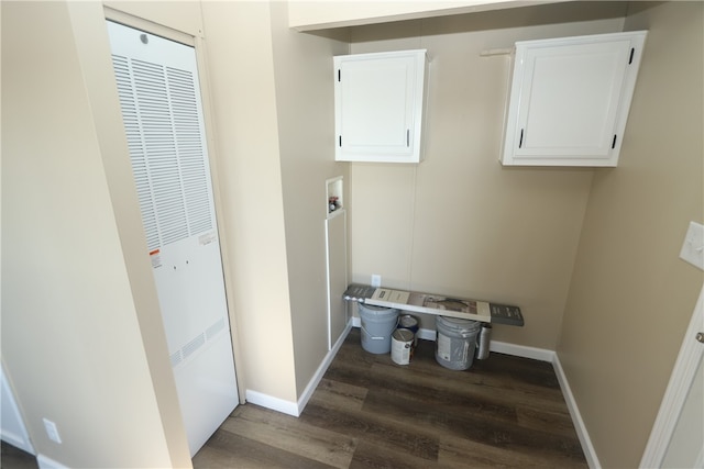 laundry area with cabinets, washer hookup, and dark wood-type flooring