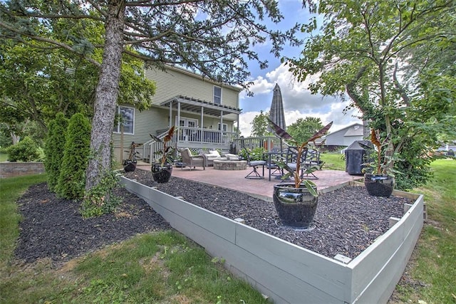 1077 Cornell Dr, Decatur, IL 62522 - view of patio featuring an outdoor fire pit and a deck