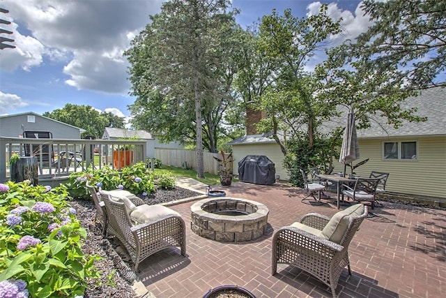 1077 Cornell Dr, Decatur, IL 62522 - view of patio with an outdoor fire pit, a grill, and a deck