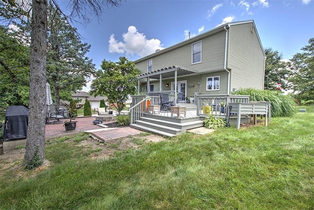 1077 Cornell Dr, Decatur, IL 62522 - rear view of property featuring a deck, a pergola, a lawn, and a patio
