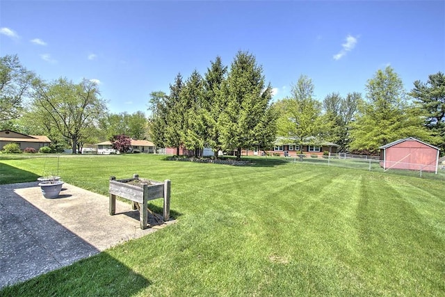 surrounding community featuring fence and a yard