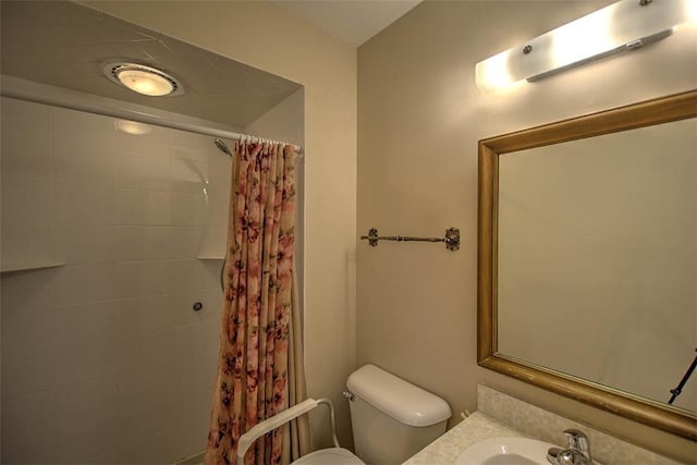 bathroom featuring vanity, toilet, and a shower with shower curtain