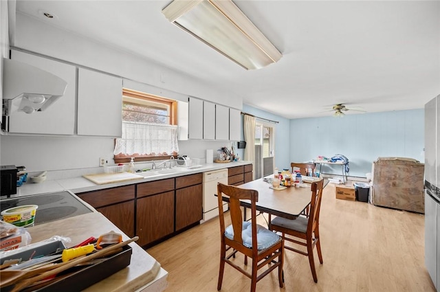 516 E Monroe Ave, Chrisman, IL 61924 - kitchen with dishwasher, light wood-type flooring, light countertops, and a ceiling fan