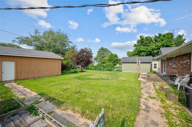 516 E Monroe Ave, Chrisman, IL 61924 - view of yard with an outdoor structure