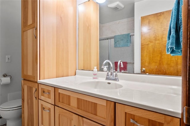 516 E Monroe Ave, Chrisman, IL 61924 - full bath with vanity, a shower stall, and toilet