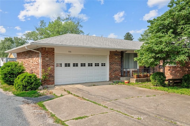 516 E Monroe Ave, Chrisman, IL 61924 - ranch-style home with a garage, brick siding, and concrete driveway