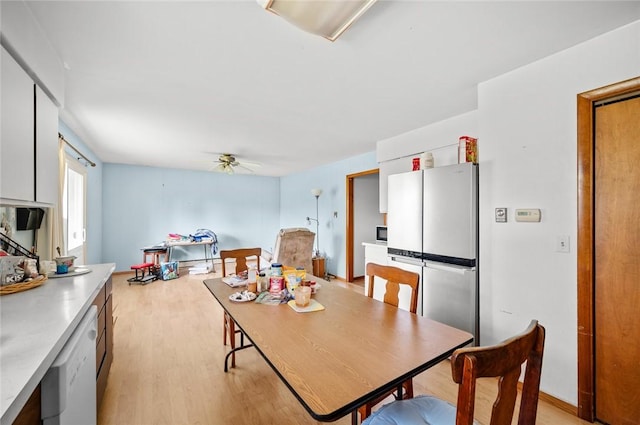 516 E Monroe Ave, Chrisman, IL 61924 - dining room with light wood finished floors and a ceiling fan
