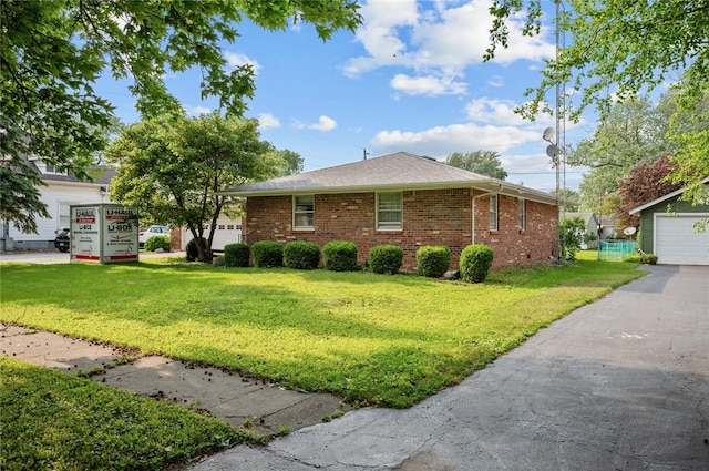 516 E Monroe Ave, Chrisman, IL 61924 - view of front of home featuring brick siding and a front lawn