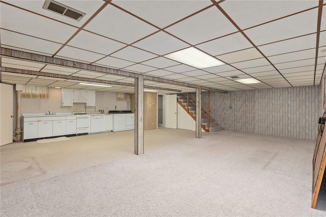 307 Gehle St, Saint Peter, IL 62880 - finished below grade area with stairway, light carpet, a drop ceiling, and a sink
