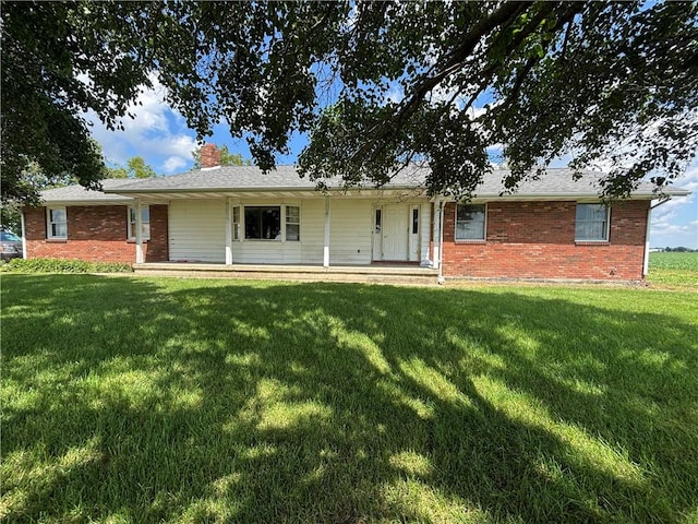 2496 N 300th St, Mason, IL 62443 - ranch-style house featuring a front lawn, brick siding, and a chimney
