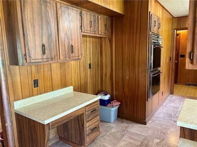 2496 N 300th St, Mason, IL 62443 - kitchen with wooden walls, light countertops, brown cabinetry, and light flooring