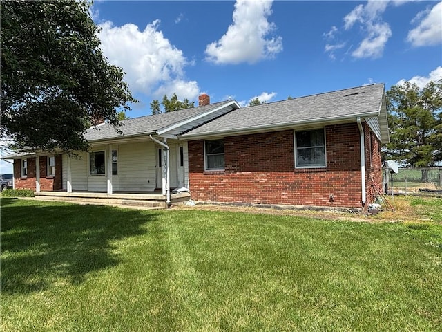 2496 N 300th St, Mason, IL 62443 - view of front of house featuring a chimney, brick siding, and covered porch