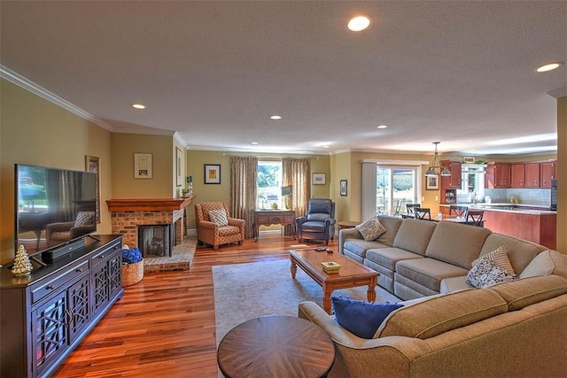 95 Hickory Point Ct, Forsyth, IL 62535 - living area featuring dark wood-style floors, recessed lighting, crown molding, and a fireplace