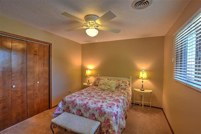 95 Hickory Point Ct, Forsyth, IL 62535 - bedroom with carpet, a closet, a textured ceiling, and ceiling fan