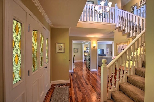 95 Hickory Point Ct, Forsyth, IL 62535 - entryway with crown molding, wood finished floors, stairway, a chandelier, and healthy amount of natural light