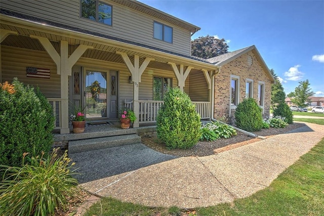 95 Hickory Point Ct, Forsyth, IL 62535 - doorway to property featuring a porch and brick siding