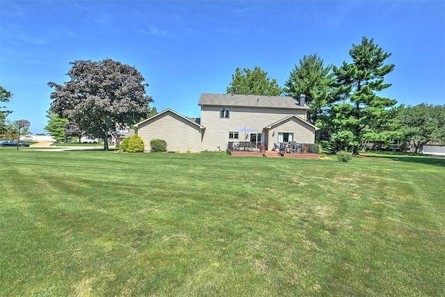 95 Hickory Point Ct, Forsyth, IL 62535 - rear view of property featuring a lawn and a wooden deck