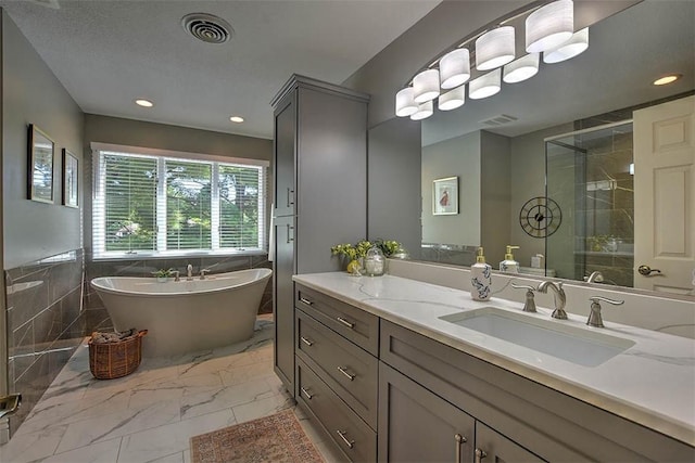 95 Hickory Point Ct, Forsyth, IL 62535 - full bath with a soaking tub, a stall shower, vanity, marble finish flooring, and tile walls