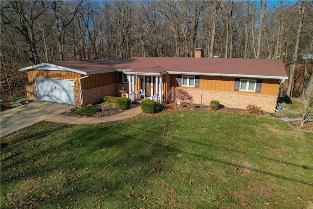 single story home with a front yard and a garage