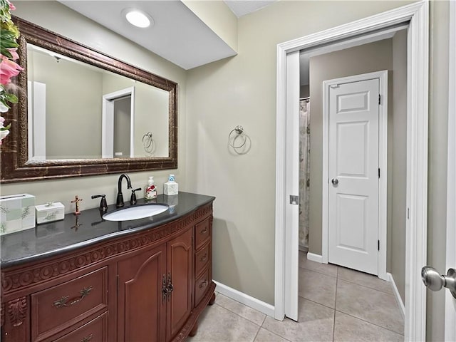 full bathroom featuring tile patterned floors, vanity, and baseboards