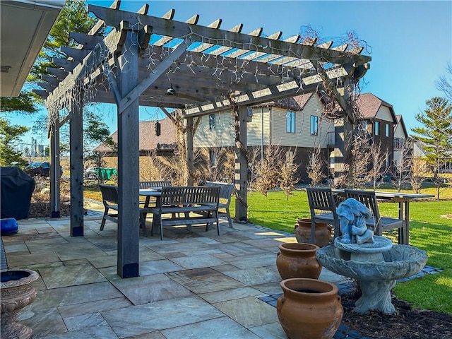 view of patio / terrace featuring area for grilling and a pergola